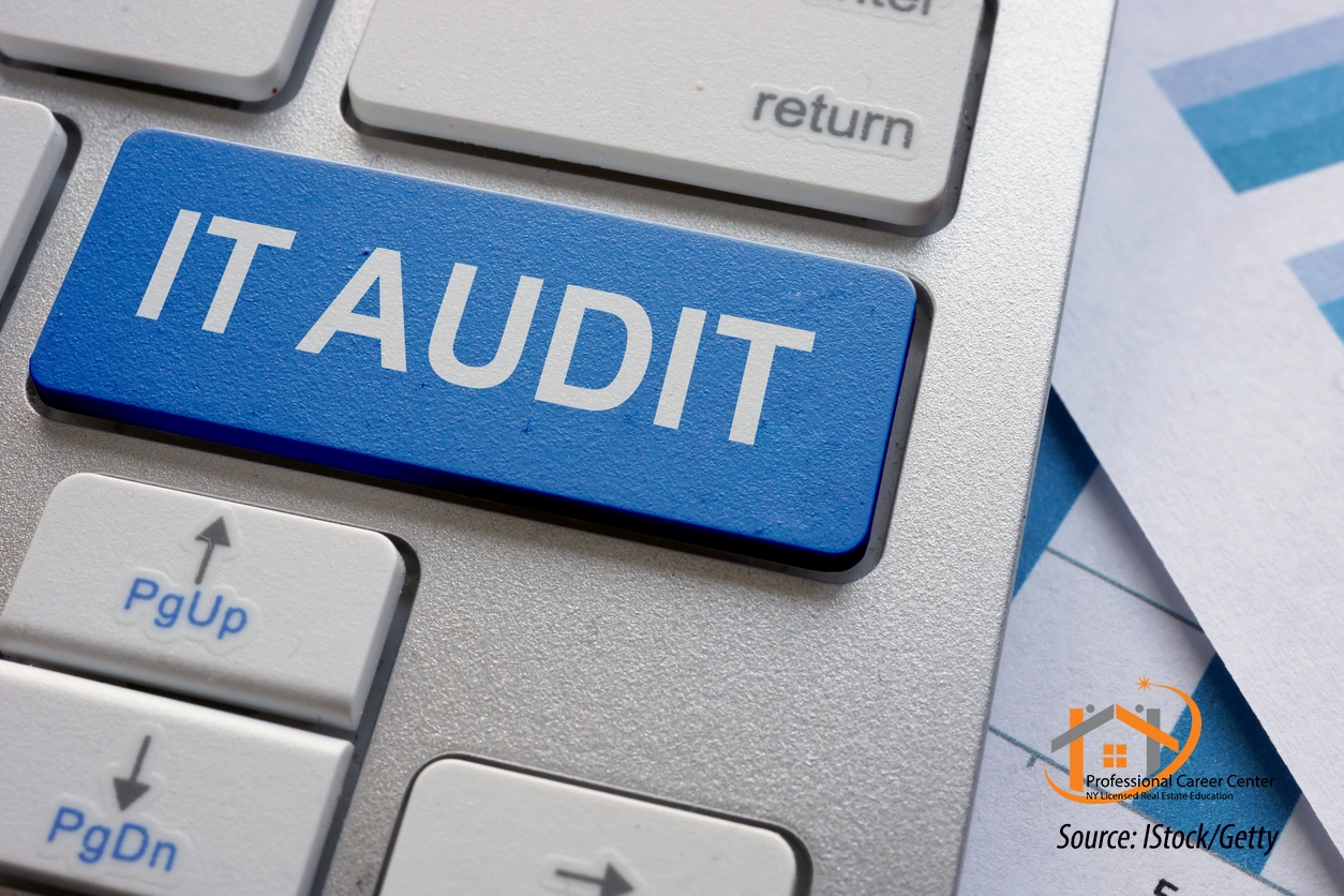 IT Audit – Real Estate Technology Stack Review Close-up of a computer keyboard with a blue key labeled IT Audit, symbolizing a review of technology systems and software tools in a real estate office