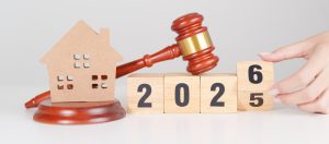 Real estate litigation risk in 2026 illustrated by judge’s gavel, house model, and calendar blocks
